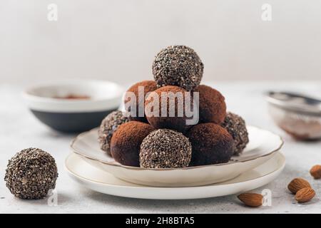 Raw energy balls made of dates, almonds, chia seeds, cocoa