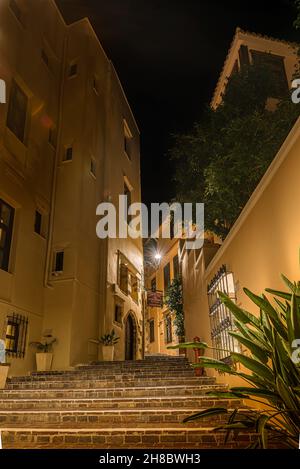 the illuminated stairs in Theofanous alley leading up to the hotel Porto del Colombo in the old town of Chania, Crete, Greece, October 13, 2021 Stock Photo