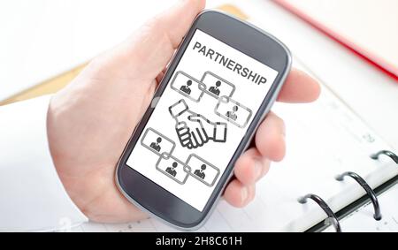 Business partnership concept shown on a smartphone screen Stock Photo