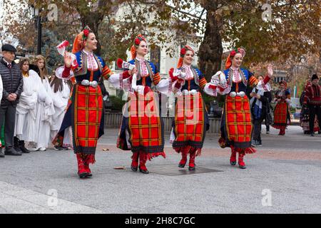 Plovdiv, Bulgaria - November 26, 2021: Young wine parade in the Old Town, traditional folklore dances Stock Photo