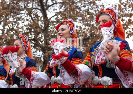 Plovdiv, Bulgaria - November 26, 2021: Young wine parade in the Old Town, traditional folklore dances Stock Photo