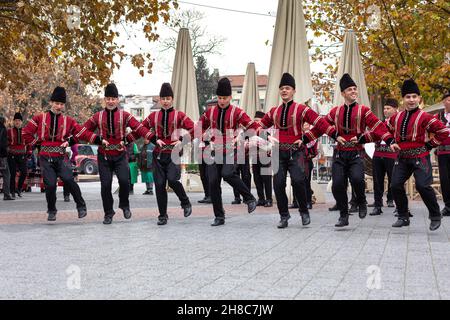 Plovdiv, Bulgaria - November 26, 2021: Young wine parade in the Old Town, traditional folklore dances Stock Photo