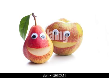 An smiling apple and a smiling pear isolated on white background Stock Photo