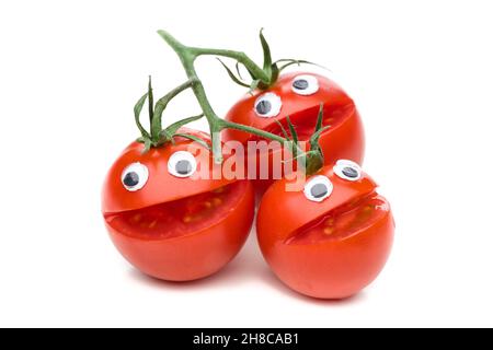 Three laughing tomatoes isolated on white background Stock Photo