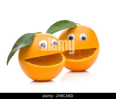 Two speaking oranges with leaf isolated on white background Stock Photo