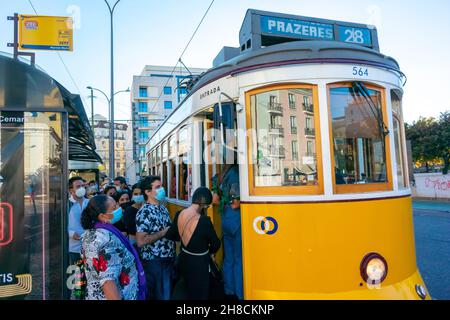 Lisbon, Portugal, Crowd Tourists Boarding Street Scene, Historic Cable Car, Tramway No. 28, vintage trolley, front Stock Photo