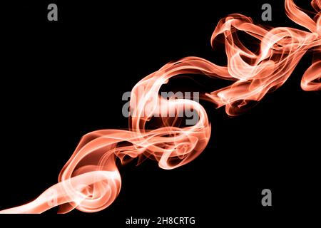 Orange color abstract smoke on black background Stock Photo