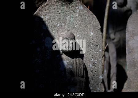 Statue in Japanese cemetery; Japan Stock Photo