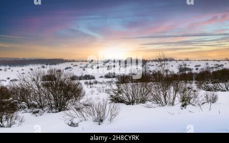 Winter meadow landscape with snow and beautiful sky. Stock Photo