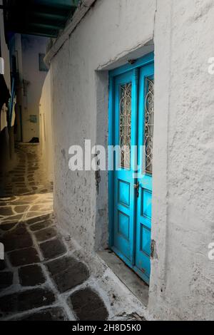 Blue double door in a dark alley in Greece. Stock Photo