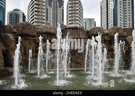 Grozny, Russia - Sept 13, 2021: Fountain and skyscrapes in capital city of the Chechen Republic in the Russian Federation Stock Photo