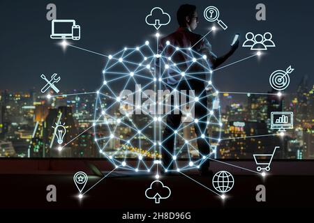 Polygonal brain shape of an artificial intelligence with various icon of smart city Internet of Things Technology over businessman using mobile with c Stock Photo