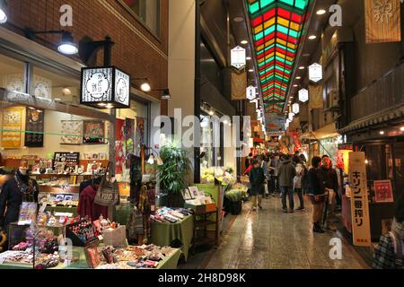 KYOTO, JAPAN - NOVEMBER 27, 2016: People visit Nishiki Market in Kyoto, Japan. Nishiki is a popular traditional food market place in Kyoto. Stock Photo