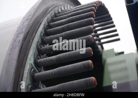 Fastening bolts of a blade from a new wind turbine on an extremely overlong heavy transport truck. German A2 freeway in Hannover district, Germany Stock Photo