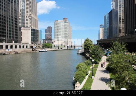 CHICAGO, USA - JUNE 27, 2013: People walk downtown in Chicago. Chicago is the 3rd most populous US city with 2.7 million residents (8.7 million in its Stock Photo