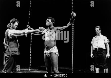 l-r: Sean Baker (Giles Pearson), Hakeem Kae-Kazim (Ide), Linus Roache (William Randall) in INDIGO by Heidi Thomas at the Royal Shakespeare Company (RSC), The Other Place, Stratford-upon-Avon  08/07/1987  design: Roger Glossop  lighting: Paul Denby  director: Sarah Pia Anderson Stock Photo