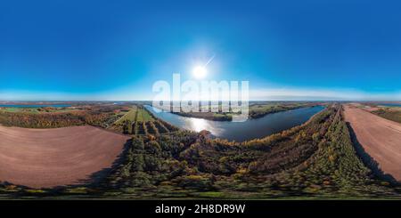 360 degree panoramic view of Beautiful sunny autumn view of a lake from a drone