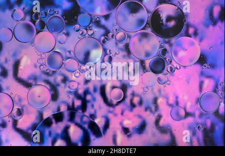abstract background of velvet violet or light purple colors of oil floating on water Stock Photo