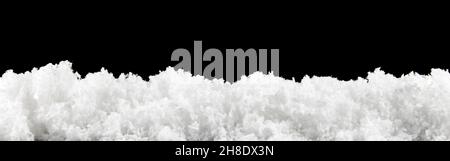 Close white snow isolated on black background Stock Photo
