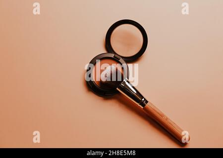 Pastel organic cosmetics. Makeup and eyeshadow brush in natural beige.. Zero waste concept, eco-friendly. flat lay, top view. Stock Photo