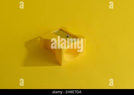 Pencil sharpener isolated on a yellow background. Stock Photo