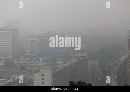 Dhaka city is covered in fog during the winter. Stock Photo