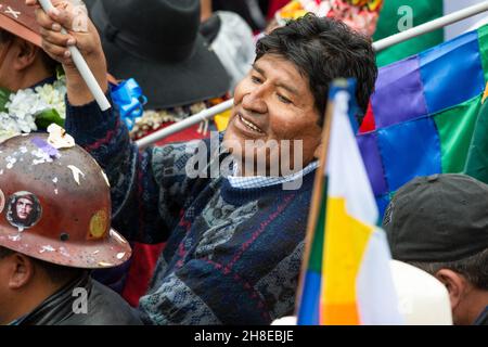 La Paz, Bolivia. 29th Nov, 2021. Evo Morales (m.), former president of Bolivia, attends a rally in support of President Arce's national government. The Bolivian leader had been under pressure from strikes in connection with his promotion of a law to combat money laundering. According to the United Nations Development Program (PNUD), 73.2 percent of Bolivia's population was employed in the informal sector in 2018. Credit: Radoslaw Czajkowski/dpa/Alamy Live News Stock Photo