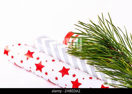 Christmas composition. Spruce branches and gift wrapping paper. Stock Photo