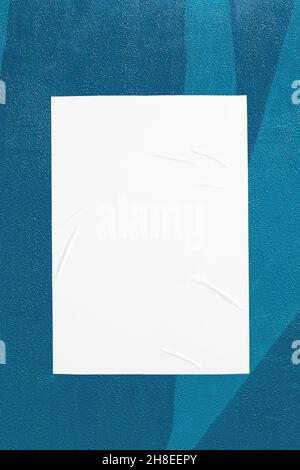 teal mint urban wall with glued poster Stock Photo