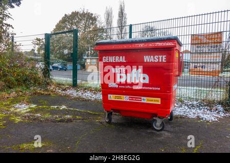 A red rubbish hopper owned by Biffa seen on a winter's day. Stock Photo