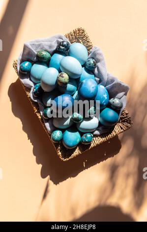 Homemade naturally dyed eggs in blue colors Stock Photo
