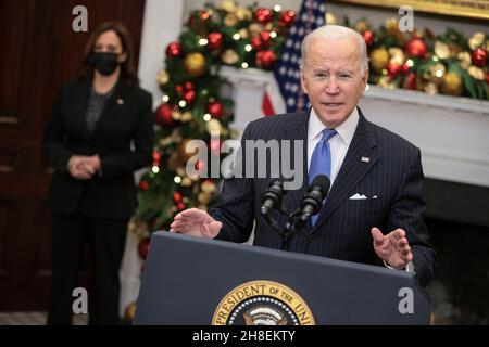U.S. President Joe Biden joined by Vice President Kamala Harris, left, speaks on the omicron variant in the Roosevelt Room of the White House in Washington, DC, U.S., on Monday, Nov. 29, 2021. Stock markets have rebounded as the picture emerging suggests the omicron Covid-19 strain is probably more transmissible but causes only mild illness and vaccines can be re-formulated to deal with it. Credit: Oliver Contreras/Pool via CNP /MediaPunch Stock Photo