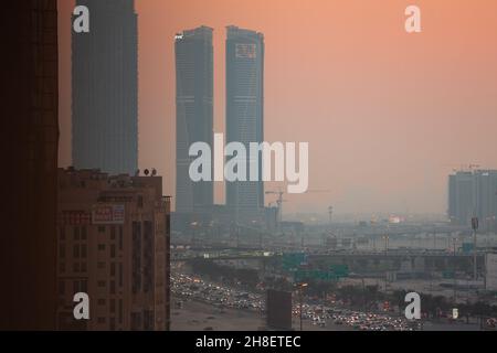 Heavy traffic in a big city,pollution by cars, emissions.Heavy-duty trucks are a major source of pollution, which includes ozone, particulate matter, Stock Photo