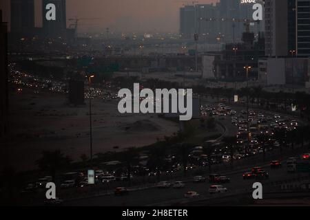 Heavy traffic in a big city,pollution by cars, emissions.Heavy-duty trucks are a major source of pollution, which includes ozone, particulate matter, Stock Photo
