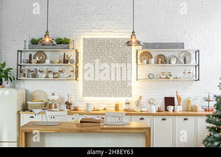 The interior of a cozy beige kitchen. Lots of kitchen utensils. Stock Photo