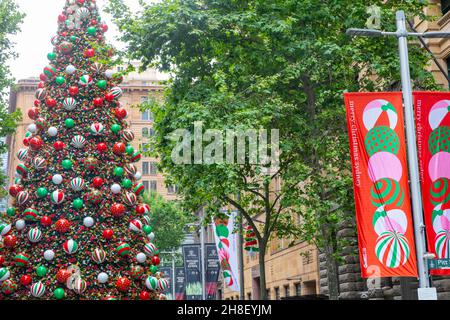 Sydney Christmas 2021, giant public Christmas tree and Christmas banners on display in Martin Place,Sydney city centre,NSW,Australia Stock Photo