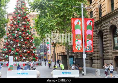 Sydney Christmas 2021, giant public Christmas tree and Christmas banners on display in Martin Place,Sydney city centre,NSW,Australia Stock Photo