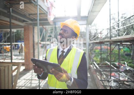 Engineer with digital tablet at construction site Stock Photo