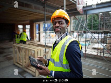 Portrait confident male architect at construction site Stock Photo