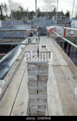 Stacked bricks at construction site Stock Photo