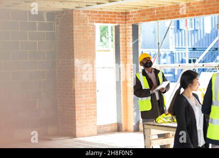 Engineer with digital tablet at construction site Stock Photo