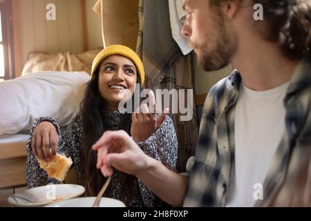 Young couple eating and talking Stock Photo