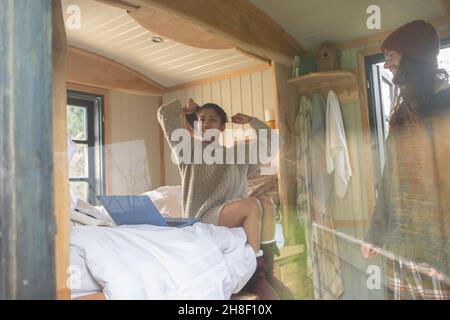 Carefree young couple in tiny cabin rental Stock Photo