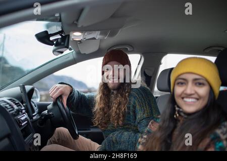 Portrait happy young couple inside car Stock Photo
