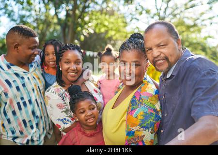 Portrait happy multigenerational family in summer park Stock Photo