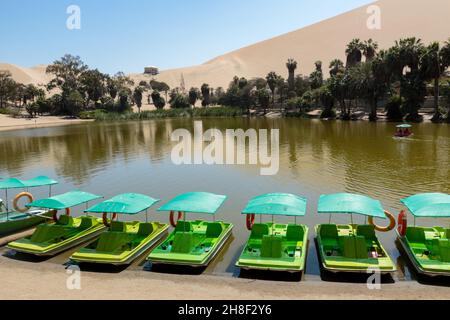 An oasis in the middle of the desert, so is this small lagoon called Huacachina in Ica - Peru; It is a popular tourist destination for its unusual sce Stock Photo