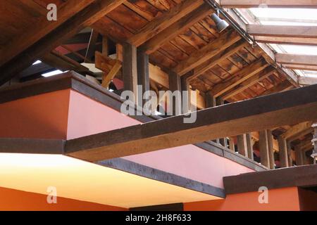 Hillside Home School interior. Architecture and decor design by Frank Lloyd Wright. There appears some modern updates to the roof supporting structure Stock Photo