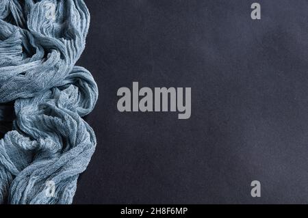 Boho style gray gauze runner, rustic tablecloth for wedding decor on dark background Stock Photo