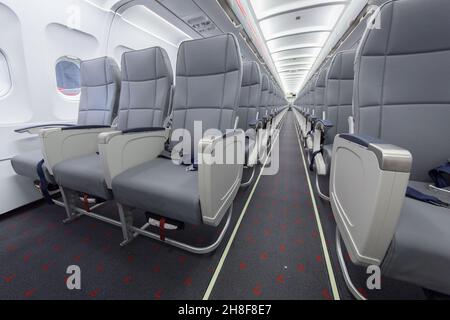 VIENNA, AUSTRIA - Mar 14, 2019: Typical seat row in an Airbus A320 commercial aircraft during maintenance works Stock Photo