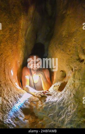 https://l450v.alamy.com/450v/2h8fawb/crawling-down-the-laundry-chute-the-royal-arches-chillagoe-queensland-australia-2h8fawb.jpg